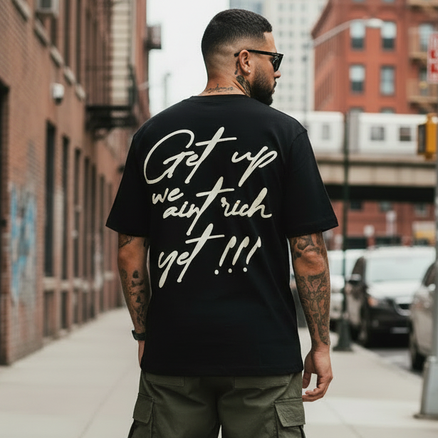 Get Up We Ain't Rich Yet - Black T-Shirt