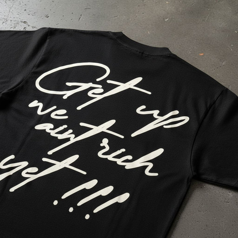 Get Up We Ain't Rich Yet - Black T-Shirt T-Shirt Million Dolla Motive 