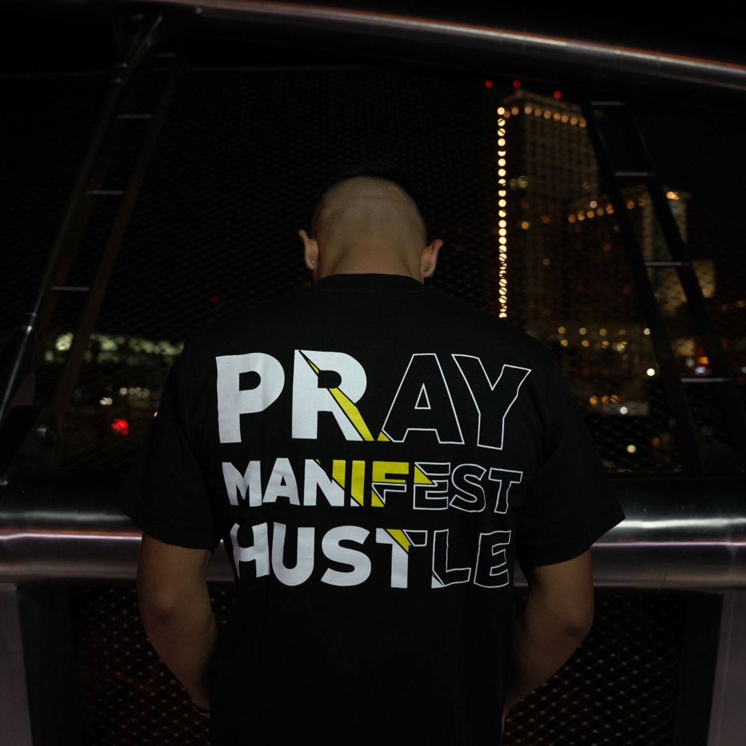 
                  
                    Pray Manifest Hustle - Black T-Shirt
                  
                