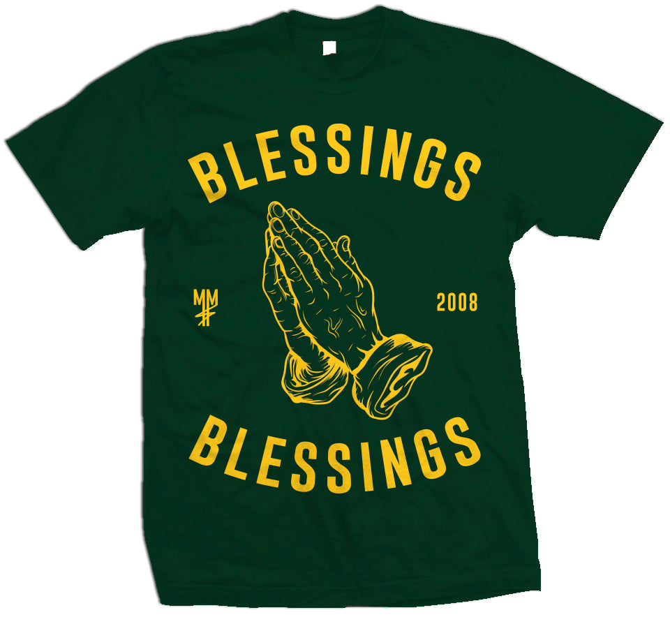 Green T-shirt with yellow prayer hands. Yellow MM, 2008, and blessings on blessings text.