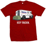 Red t-shirt with white, blue, and red bricks truck unloading pallet of money with white keep truckin text.