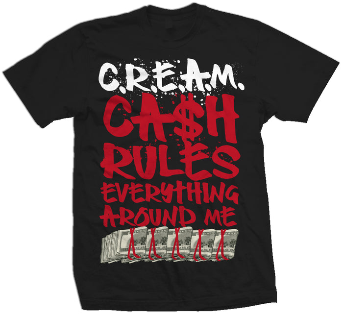Black T-shirt with white and red cream, cash rules everything around me text with hundred dollar bill row.