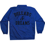 Royal blue windbreaker coach jacket with black million dolla motive text on front and dollars & dreams text on back.
