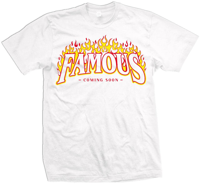 White t-shirt with yellow, orange, and red flames  and yellow, red, and white famous coming soon text.