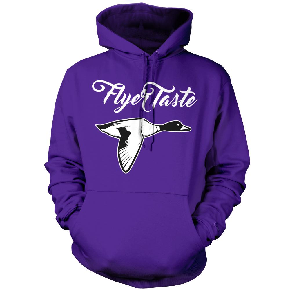 Purple hoodie sweatshirt with white and black flying duck and white flyer taste text.