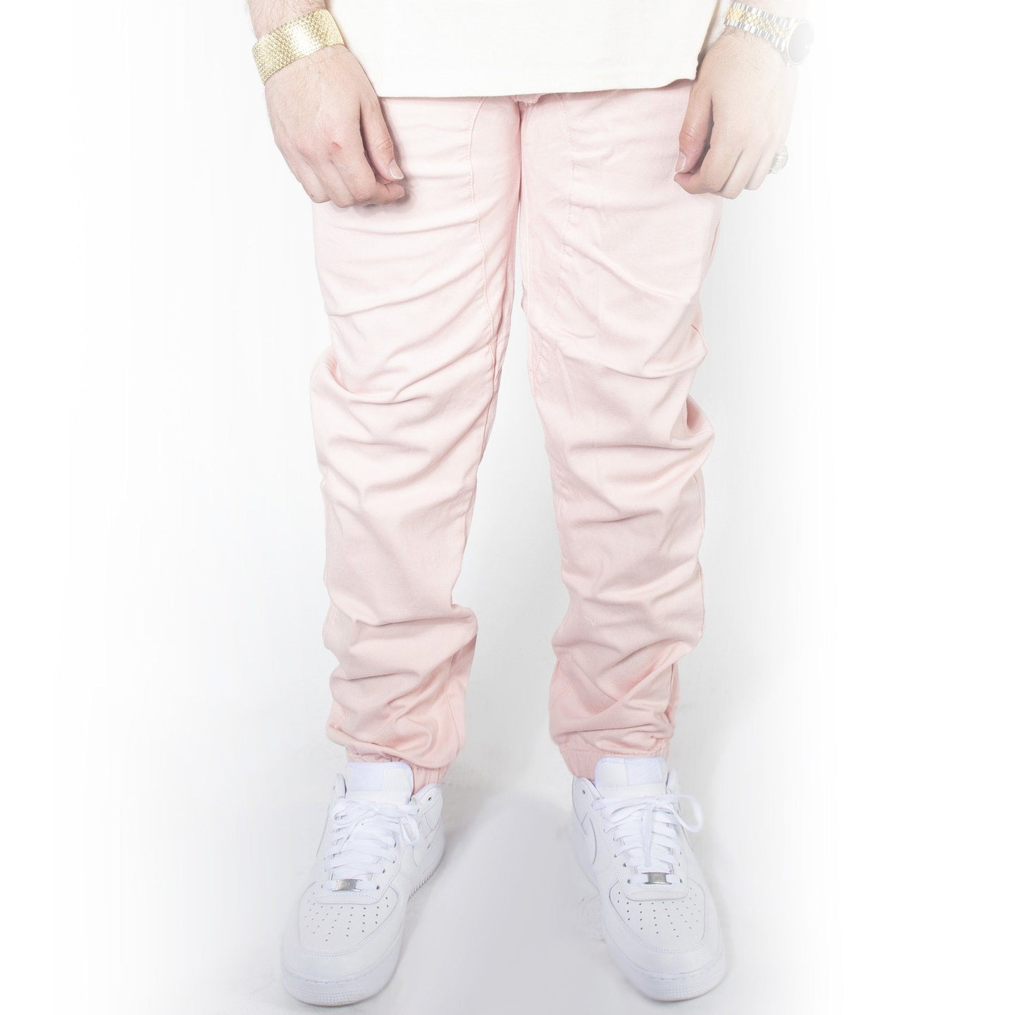 Pink twill jogger pants with jordans.