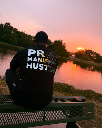 Pray Manifest Hustle, golden hour